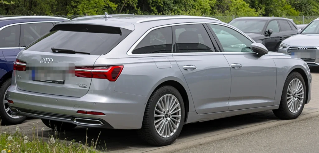 Silver Audi A6 Avant parked outdoors, viewed from the rear three-quarter angle.